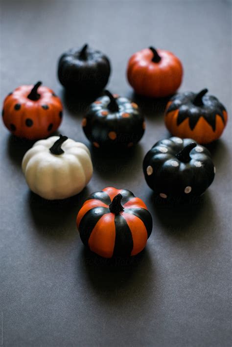 Assorted Decorated Pumpkins On Black Del Colaborador De Stocksy