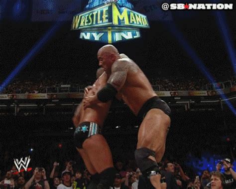 GIF IMAGE: The Rock and CM Punk Break Spanish Announce Desk Wrestling ...