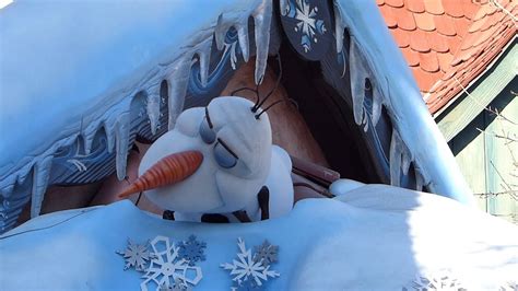 Olaf From Frozen Snoring On Top Of Anna And Elsas House At Disneyland