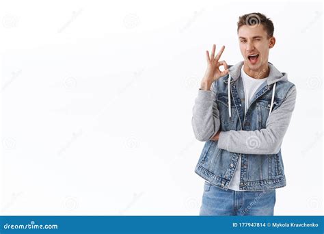 Cheeky Coquettish Gay Man With Blond Hair Got Everything Under Control Flirty Wink And Smiling