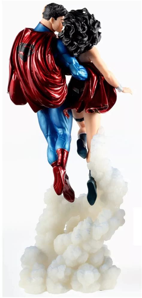 Superman And Superwoman Kissing