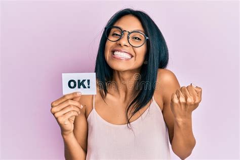 Young African American Woman Holding Ok Message Paper Screaming Proud Celebrating Victory And