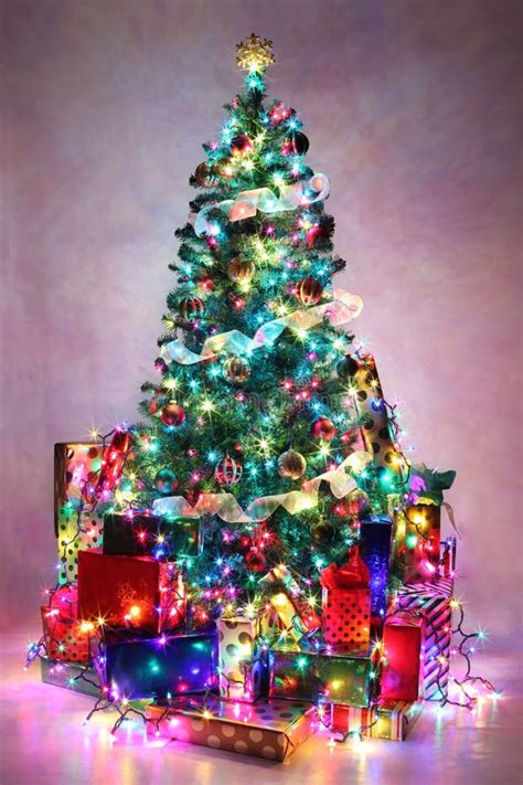 Decorated Christmas Tree Surrounded By Colorful Presents Stock Photo