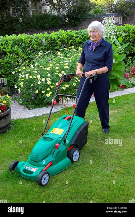 Mature Woman Mowing The Lawn Hi Res Stock Photography And Images Alamy