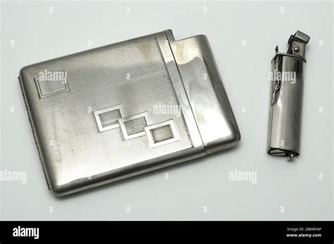 vintage metal cigarette case with lighter Stock Photo - Alamy