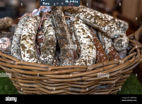 Stacks Of Dry Cured Sausages Saucisson Typically Made Of Pork Or A