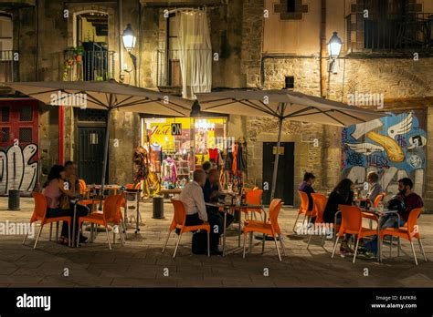 Night view of a Barrio Gotico outdoor cafe with tourists seated ...