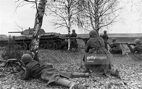 World War Two Soviet Infantry Supported By Tanks Firing On German