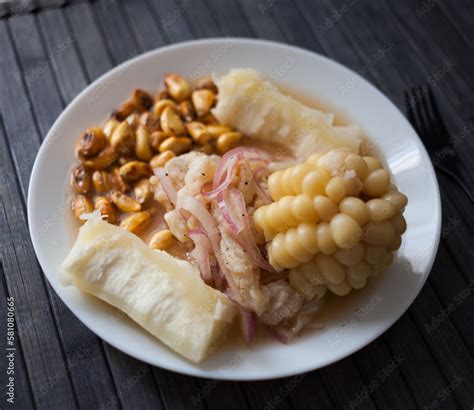 Peruvian traditional dish.fish ceviche with yuka and corn Stock Photo ...