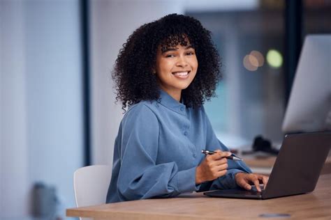 Premium Photo | Happy working and portrait of a black woman on a laptop ...