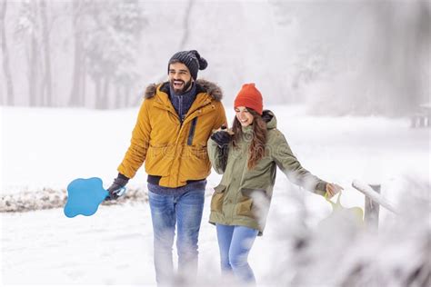 Couple Holding Hands And Taking A Walk On Snowy Winter Day Stock Image