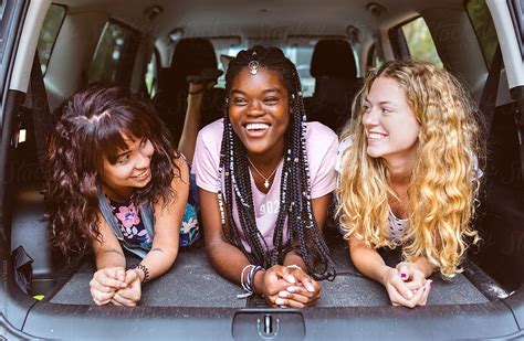 Three Young Friends Having Fun In A Car By Stocksy Contributor Marco