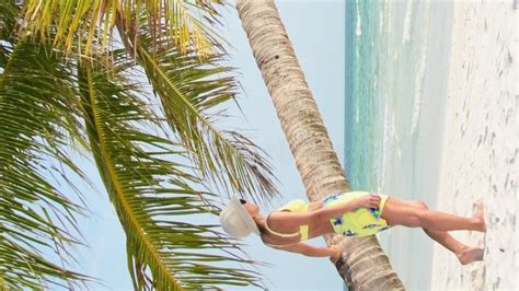 Happy Millennial Caucasian Woman Stands Wearing Bikini On A Tropical Beach In Sunny Summer Day