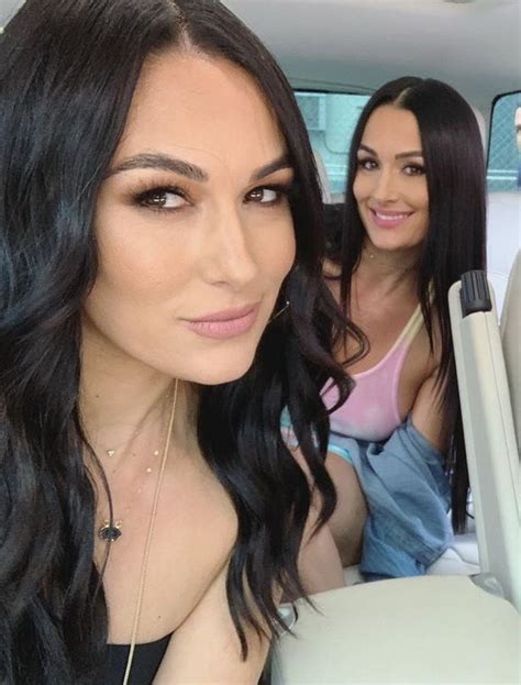 Two Women Sitting In The Back Seat Of A Car One With Long Black Hair