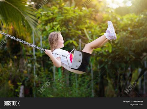 Child Swinging On Image And Photo Free Trial Bigstock