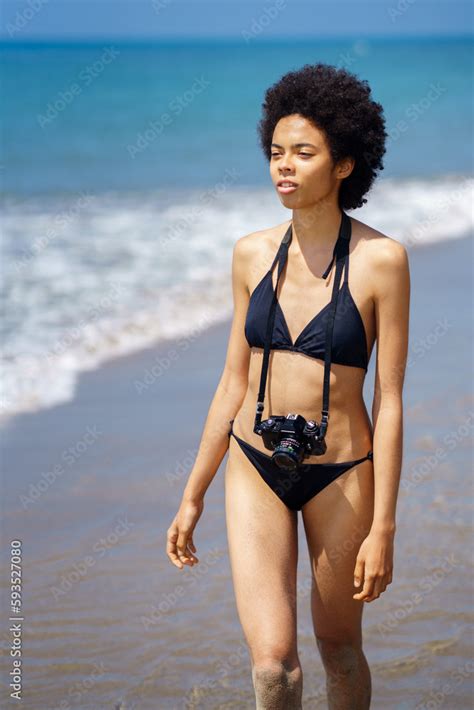 Black Woman In Bikini With Photo Camera On Seashore Stock Photo Adobe Stock