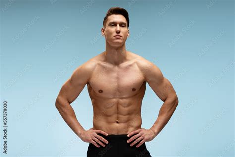 Strong Athletic Man Fitness Model Posing With Naked Torso Showing Six Pack Abs Stock Photo