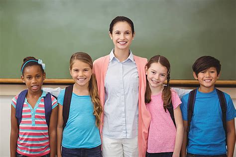 Teacher And Pupils Smiling In Classroom Woman Pupil Occupation Photo Background And Picture For