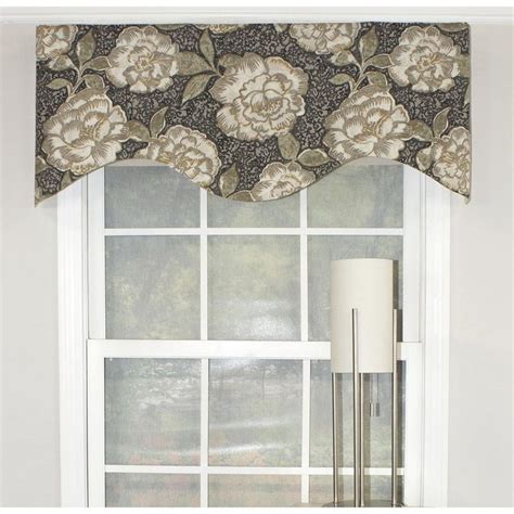 a window with a flowered valance hanging over it