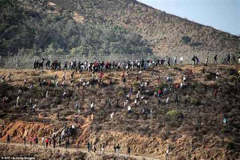 Migrants Storm EU Border Hundreds Swarm Barbed Wire Fence After