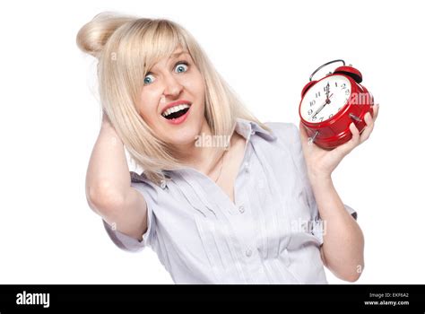 Shocked Beautiful Young Woman With Alarm Clock Isolated On White Stock