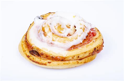 Sweet bun with raisins and white sugar icing. Studio Photo. 4414167 ...