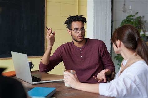 Photo Of Man Holding Pen · Free Stock Photo