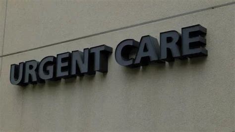 a large sign on the side of a building that says urgent care written in ...