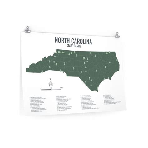 the north carolina state parks map hanging on a wall