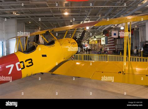 Yellow Biplane Exhibit The Former US Navy Aircraft Carrier USS