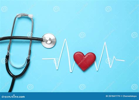 Paper Cardiogram Line Red Heart And Stethoscope On Light Blue