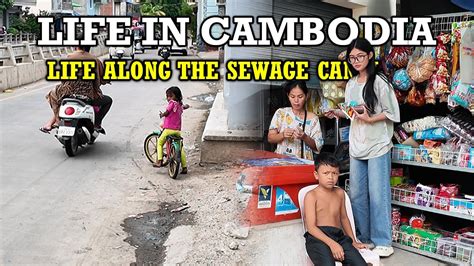 LIFE ALONG THE SEWAGE CANAL In PHNOM PENH CITY CAMBODIA 2K Walking