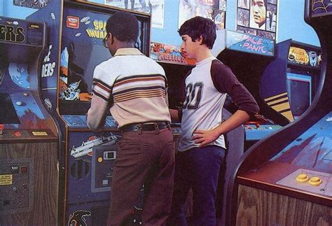 Two Young Teenagers Play Space Invaders In A Video Game Arcade1980s R80s