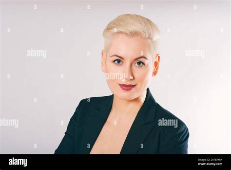 Business Portrait Of Beautiful Mature Woman Wearing Jacket Posing On