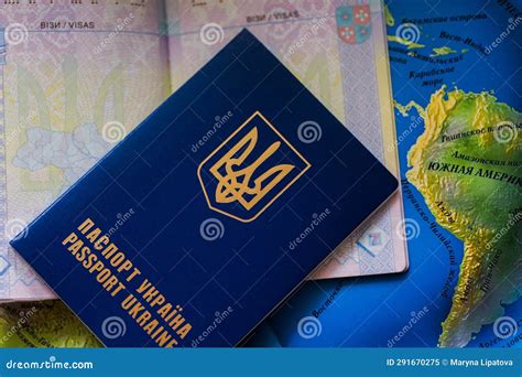 A Closed Foreign Passport Of Ukraine Lies On An Open Passport And On