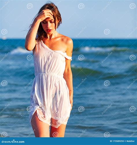 Woman In White Wet Dress Posing In A Sea Waves Stock Image Image Of