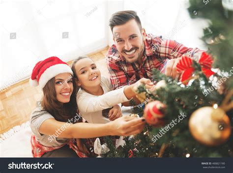 Family Decorating Christmas Tree Stock Photo 488821180 | Shutterstock