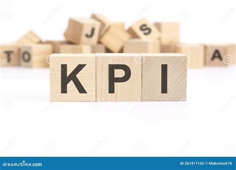 Text Kpi Key Performance Indicators Is Written On Three Wooden