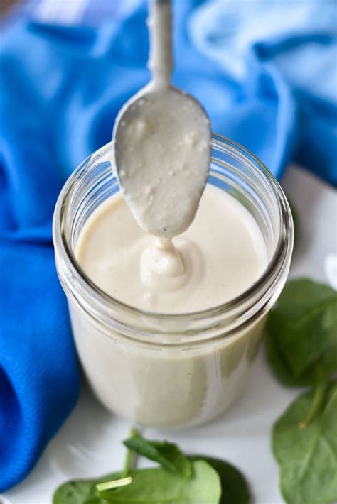 Creamy Parmesan Dressing With Two Spoons