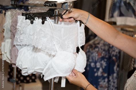 Woman Selecting New Bra In Lingerie Department Stock Photo Adobe Stock