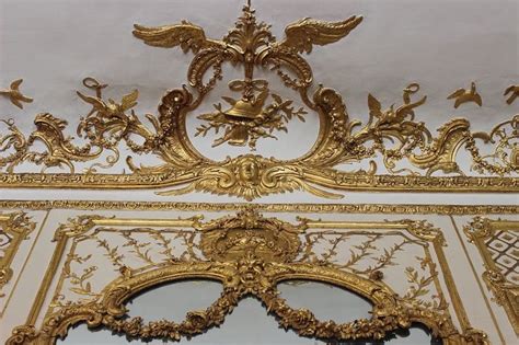 An Ornately Decorated Wall With Gold Paint