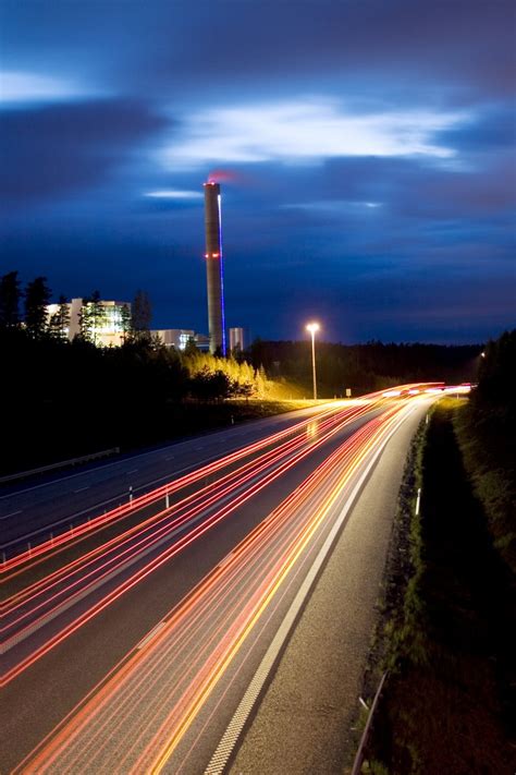 Highway at night with light trails and chimney smoke Free Stock Photo ...