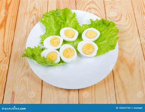 Halves Of Boiled Chicken Eggs On Lettuce On Dish Stock Photo Image Of