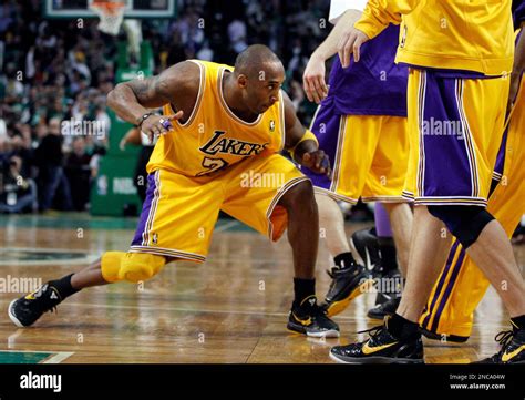 Los Angeles Lakers Guard Kobe Bryant 24 Bends Low For A High Five