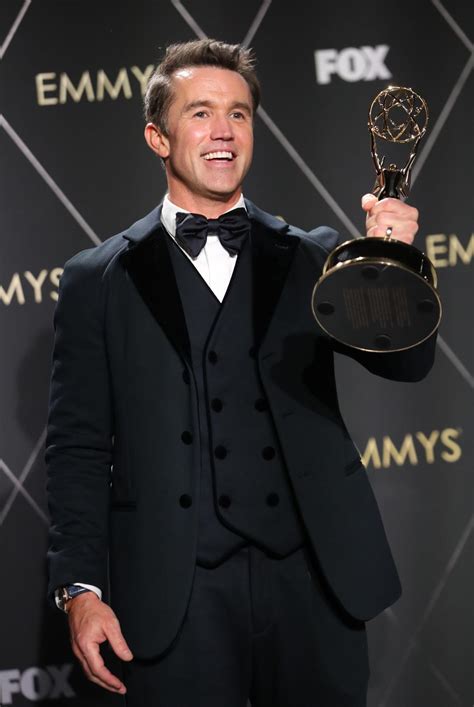 Rob McElhenney watches Eagles game on his phone during the Emmys