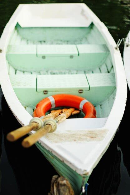 Premium Photo Green Row Boats With Row At A Lake