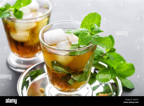 Mint Julep Cocktail With Bourbon Ice And Mint In Glass On Black