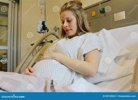 In The Hospital Woman In Labor Pushes To Give Birth Obstetricians