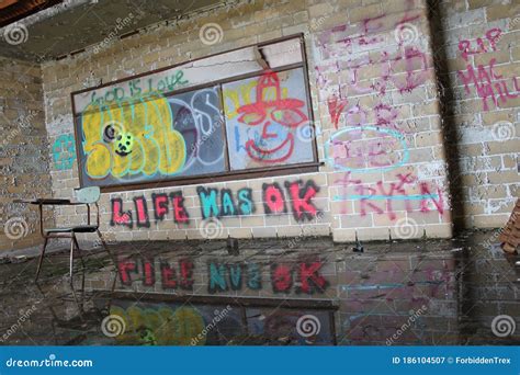 `Life Was OK` Abandoned Classroom with Single Desk Chair and Graffiti ...