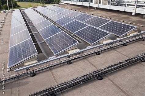 Solar panels on a flat roof. Stock Photo | Adobe Stock